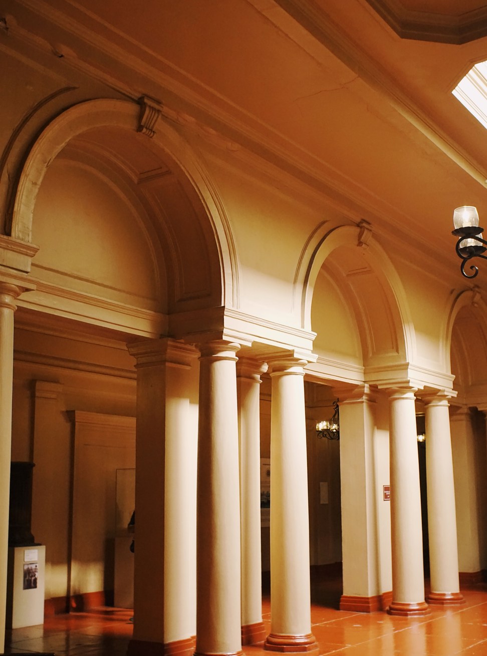 Warm stone columns and vaulted arches