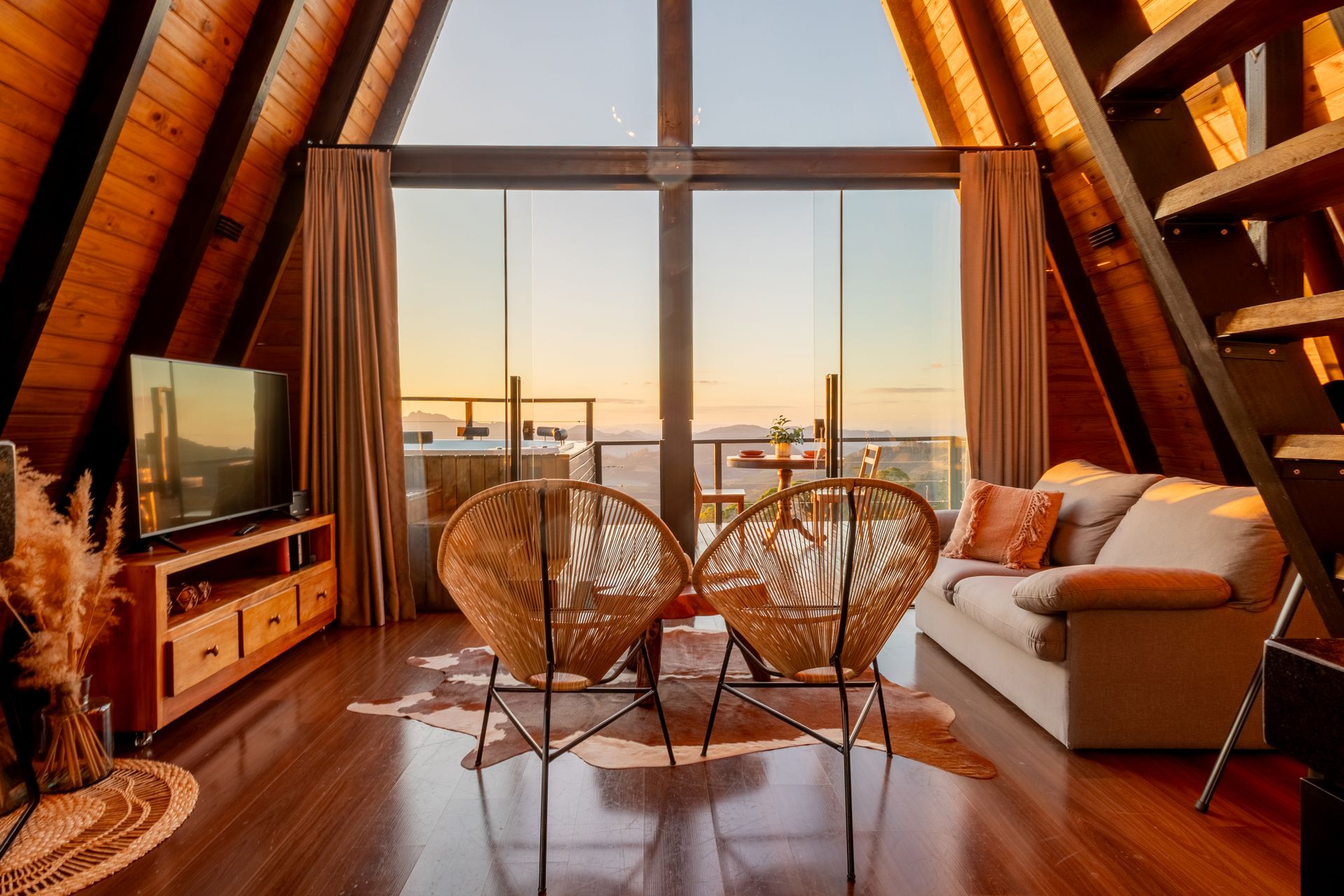 A timber-lined mountain residence with panoramic windows