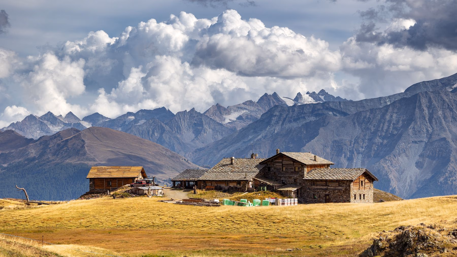 A remote mountain residence surrounded by an alpine landscape