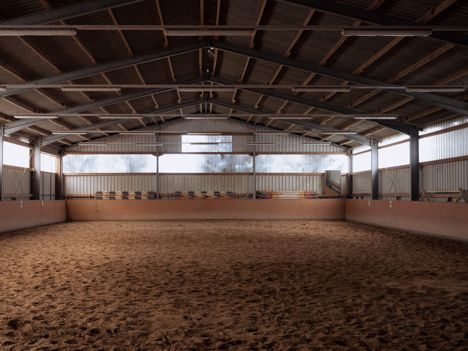 A spacious indoor equestrian arena