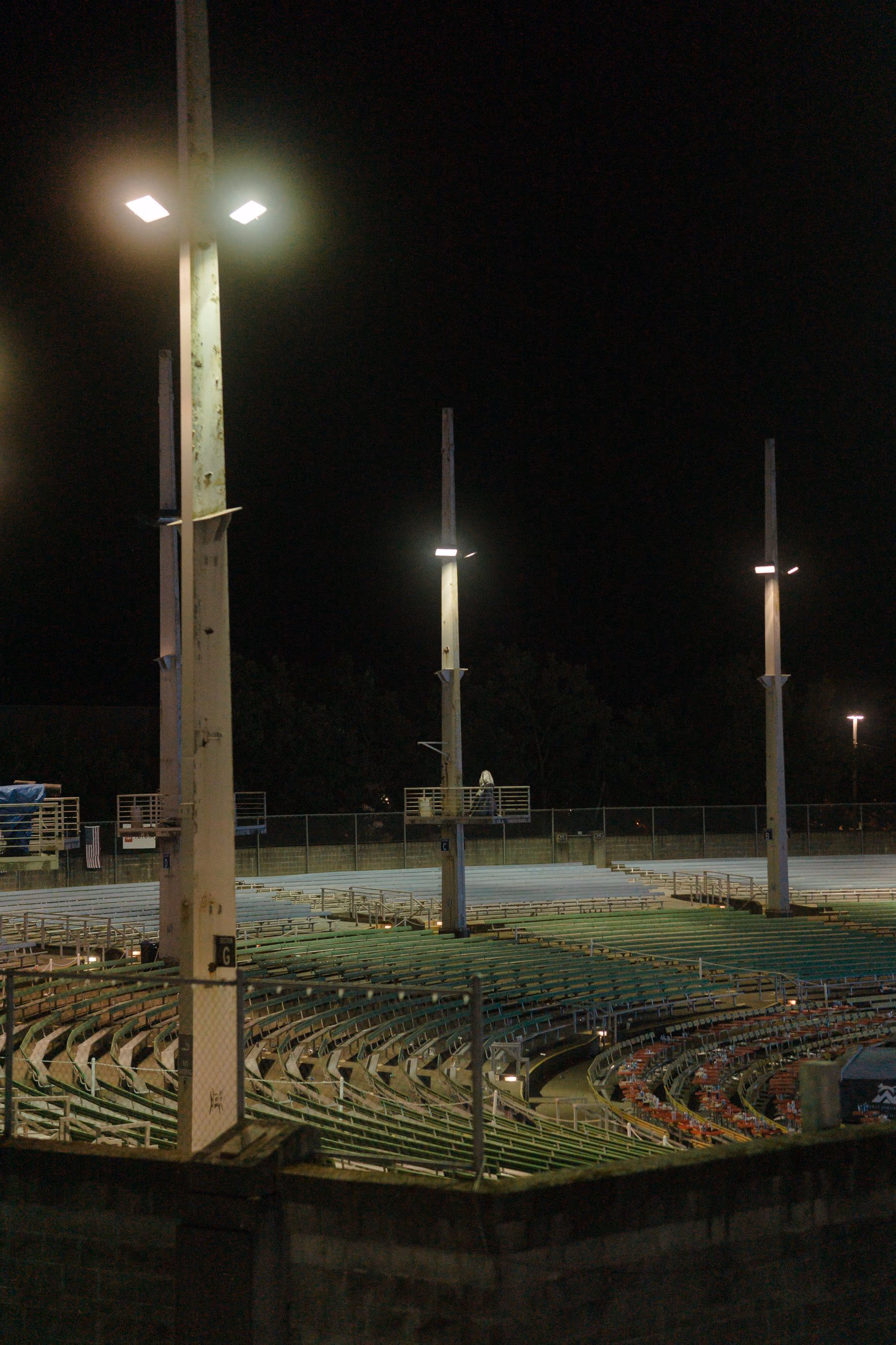 An empty football ground illuminated at night