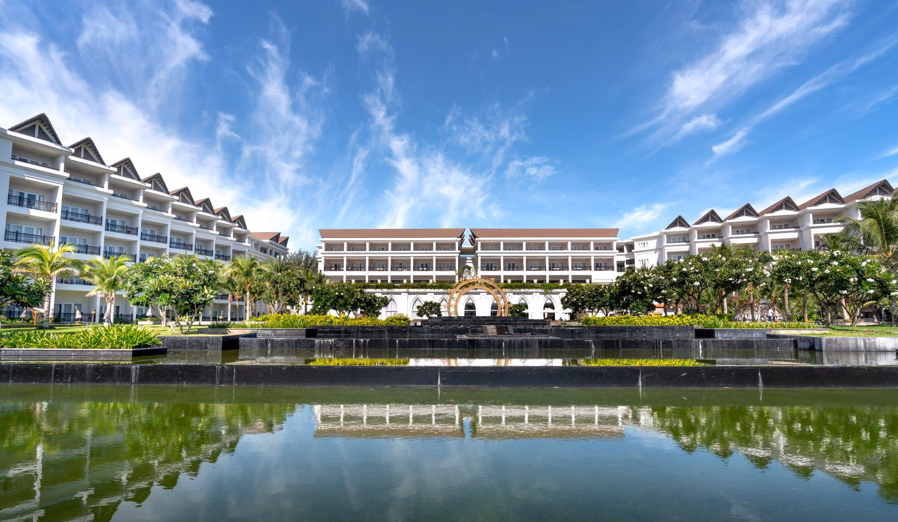 A hospitality property reflected in landscaped water gardens